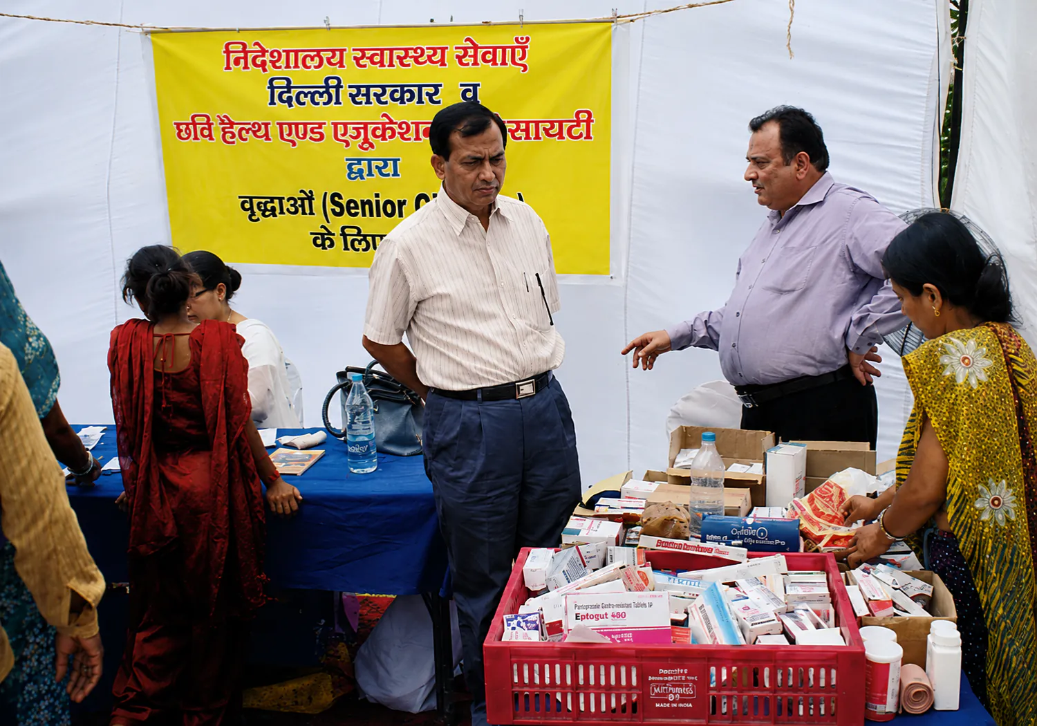 CHES staff and doctors attending to senior citizens at a health camp run with the Directorate of Health Services, Delhi Government